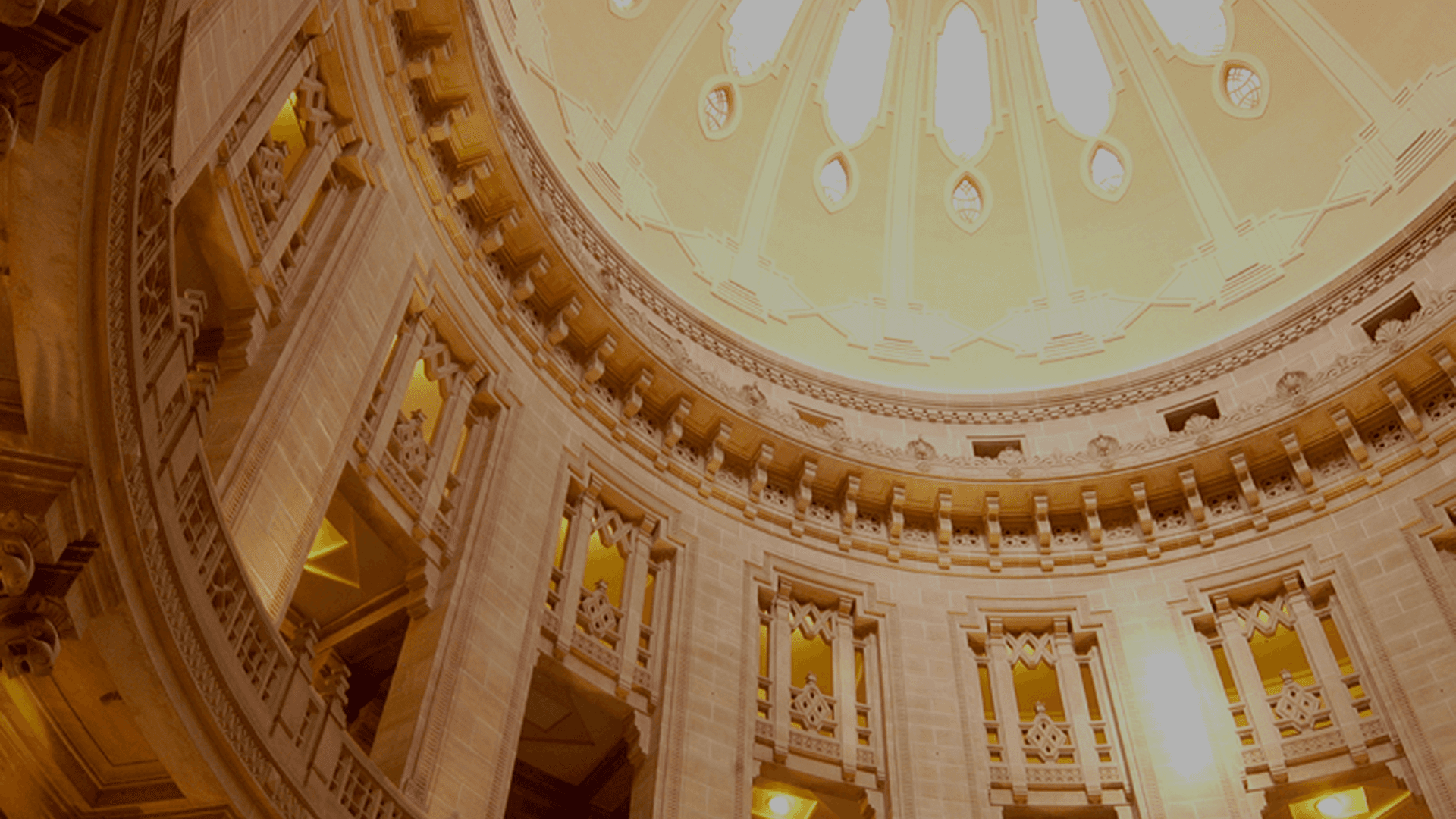 Elegant circular dome with intricate carvings and warm lighting