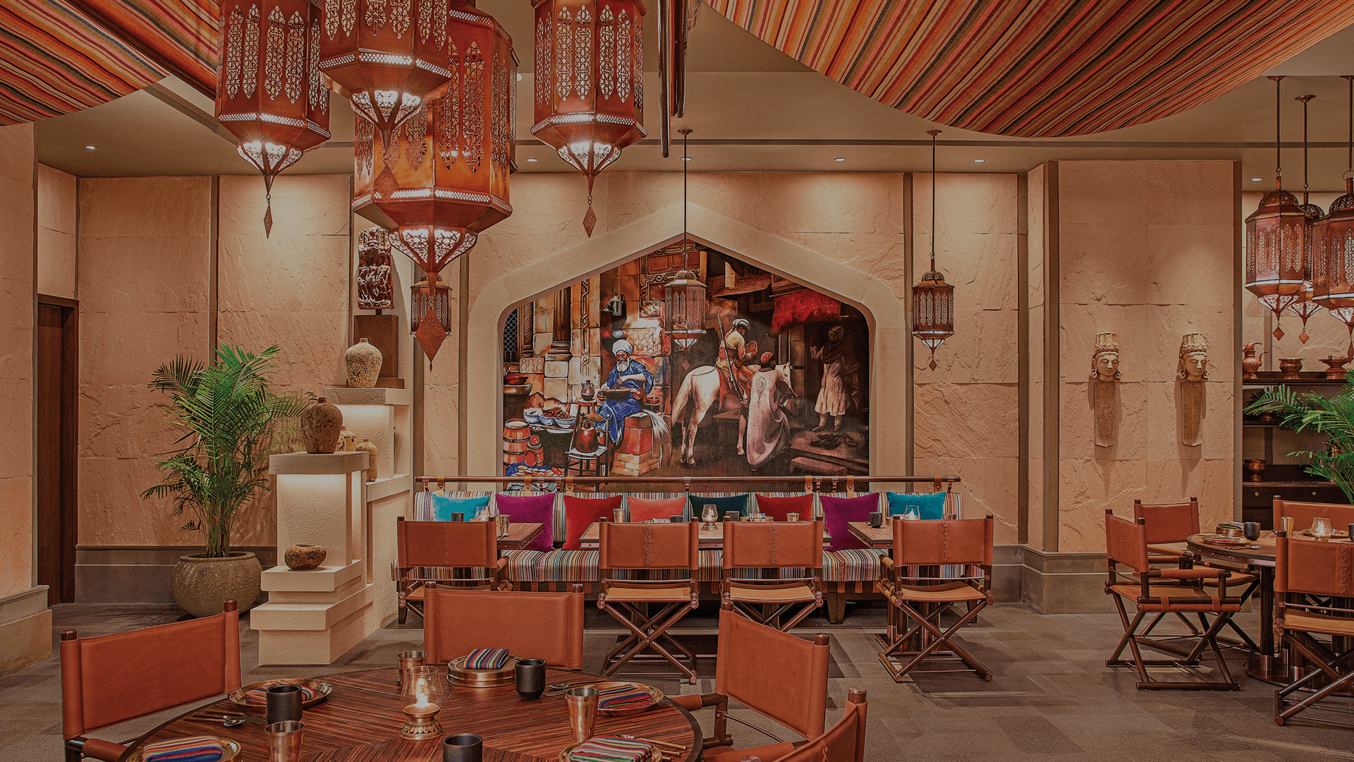 Elegant restaurant interior with lantern lighting and wooden furniture
